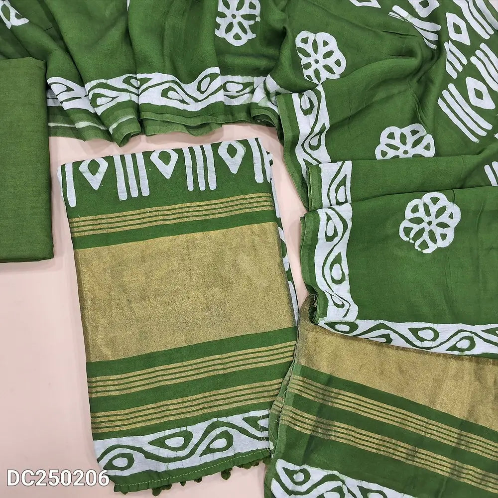 Original batik dyed leafy Green fancy silk cotton unstitched salwar material(lining needed) tissue borders on daman, matching silky bottom, batik dyed fancy silk cotton dupatta with tissue border on pallu, pompom tapings. DC250206