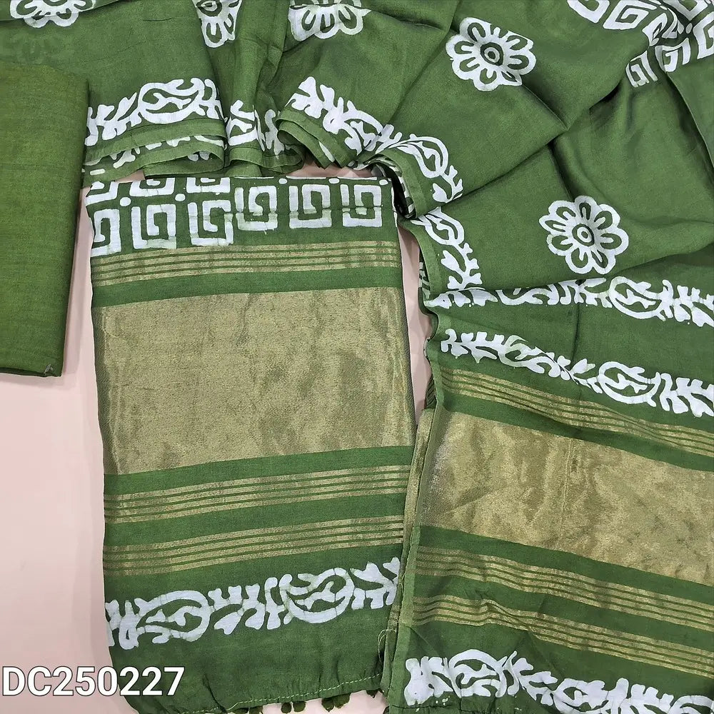 Original batik dyed leafy Green fancy silk cotton unstitched salwar material(lining needed) tissue borders on daman, matching silky bottom, batik dyed fancy silk cotton dupatta with tissue border on pallu, pompom tapings. DC250227