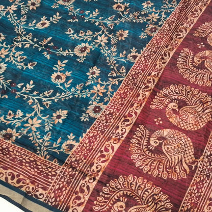 Floral printed teal Green premium silk cotton unstitched salwar material(lining needed) printed reddish maroon daman, matching spun cotton bottom, floral printed premium silk cotton full length dupatta with printed reddish maroon pallu. DC250420