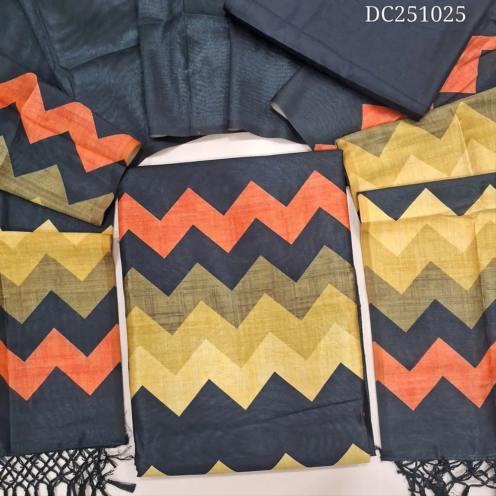 Black fancy semi tussar unstitched salwar material (lining needed) yellow zigzag printed daman, or yoke, matching silky bottom, zigzag printed fancy semi tussar full length dupatta with tassels. DC251025
