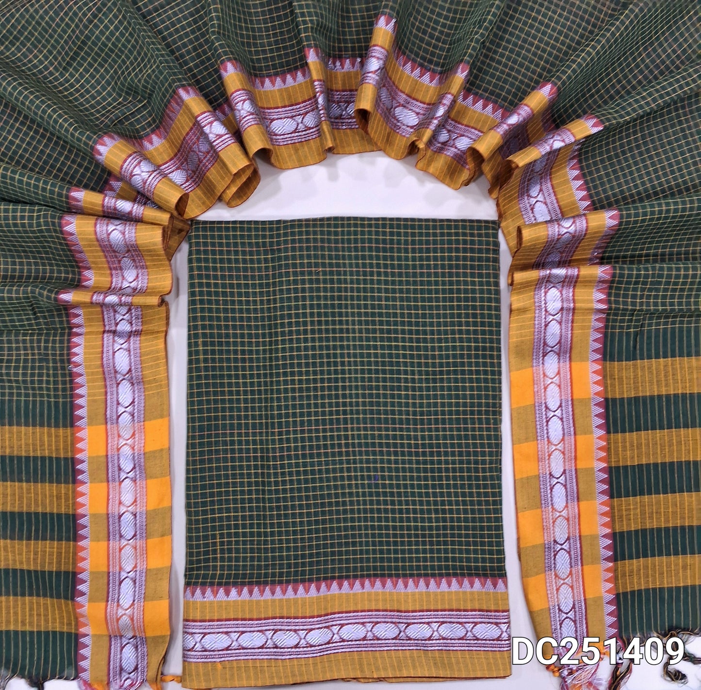 Dark Green mercerised handloom cotton unstitched salwar material, checked all over, double side borders (Thin, Lining Needed) Fabric Measurement : 4.5 Metres, Full length dupatta. Note : Weaving Inconsistencies are not defects. DC251409