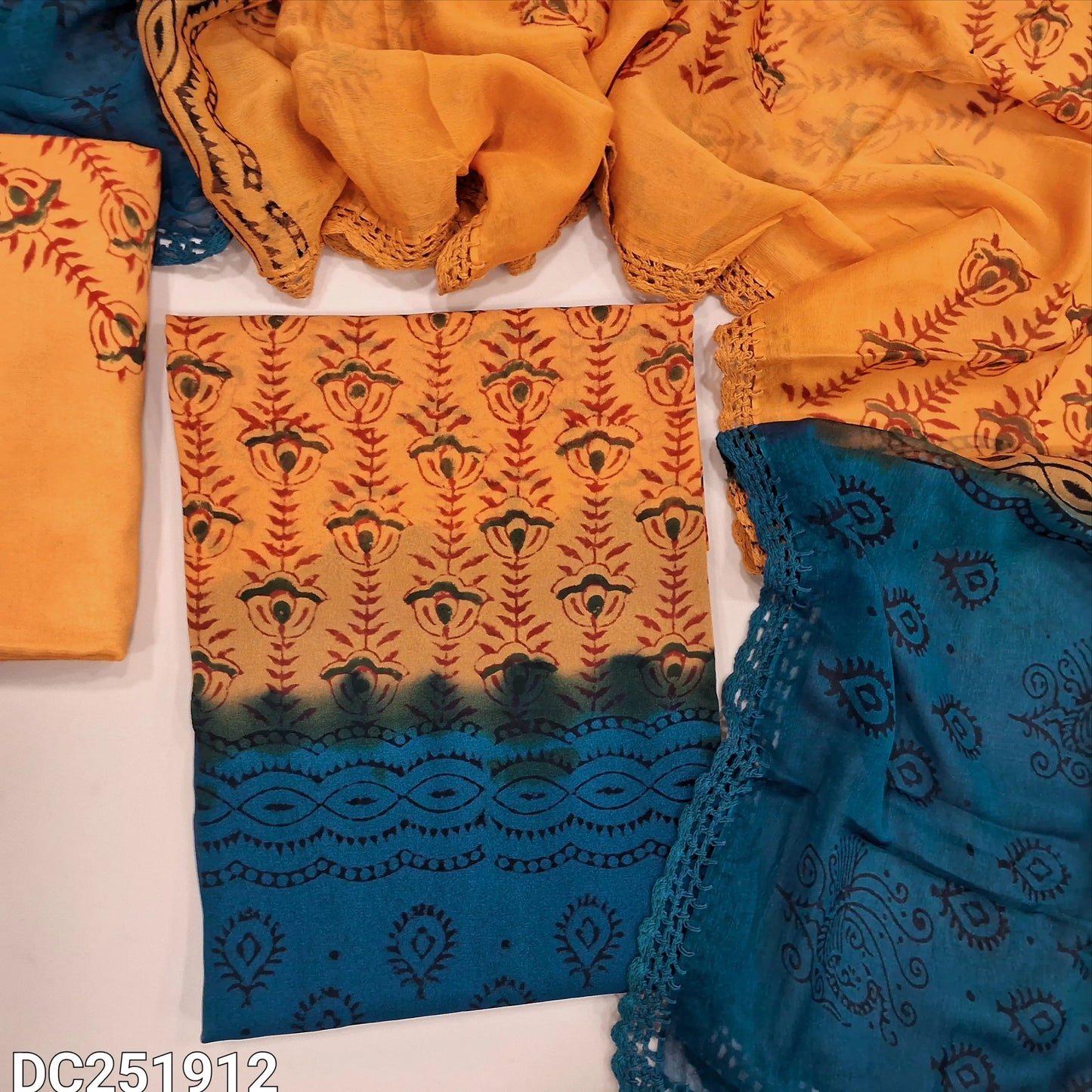 Orange & teal blue crepe georgette unstitched salwar material (lining needed) hand block printed allover, santoon bottom, crochet work on dual shade chiffon dupatta (TAPING NEEDED). DC251912 (over lapping of prints not consider as a defect