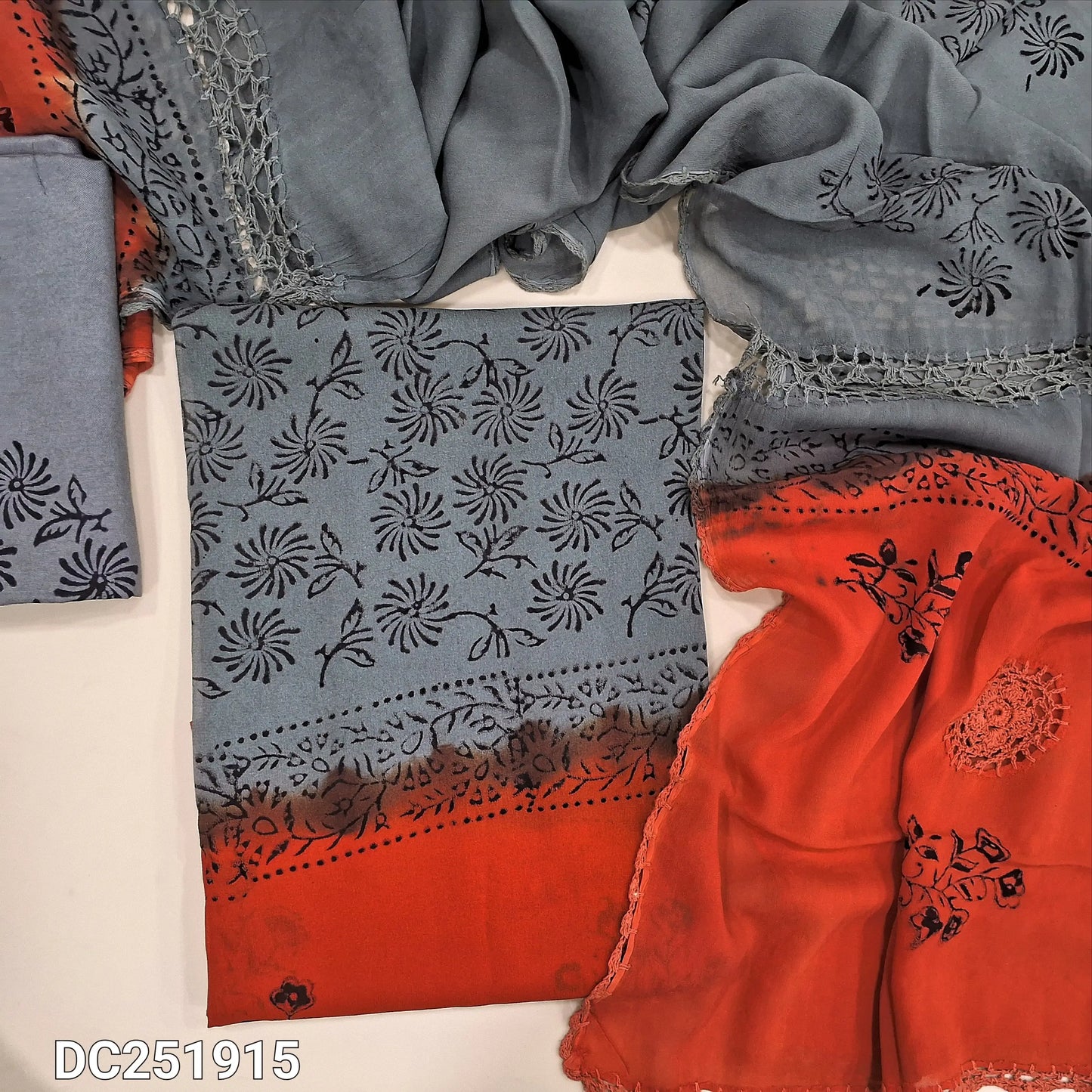 Grey & bright Orange crepe georgette unstitched salwar material (lining needed) hand block printed allover, santoon bottom, crochet work on dual shade chiffon dupatta (TAPING NEEDED). DC251915 (over lapping of prints not consider as a defect
