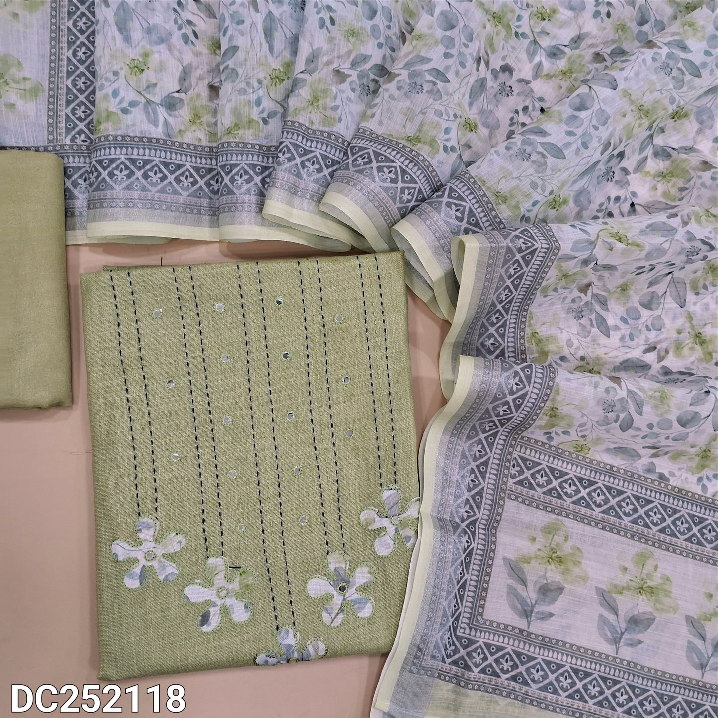 Pastel Green semi linen unstitched salwar material (lining optional) kantha stitch, applique work on yoke, matching santoon bottom, digital floral printed semi linen dupatta. DC252118