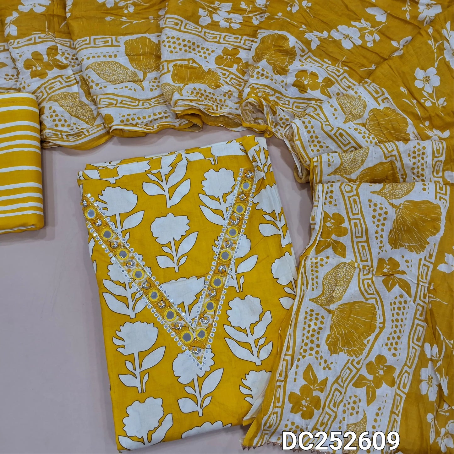 Floral printed Mehandhi Yellow soft cotton unstitched salwar material (lining needed) digital floral printed allover, v neck, real mirror work on front. matching cotton bottom, crinkled printed soft cotton dupatta. DC252609