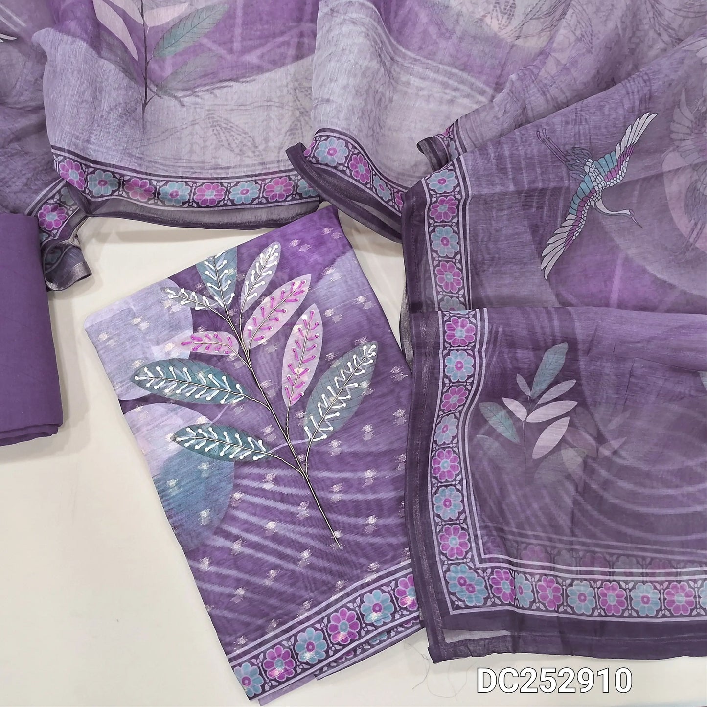 Designer digital printed Purple silk cotton unstitched salwar material (lining needed) thread, zardozi work on front, matching santoon bottom, digital printed soft silk cotton dupatta. DC252910