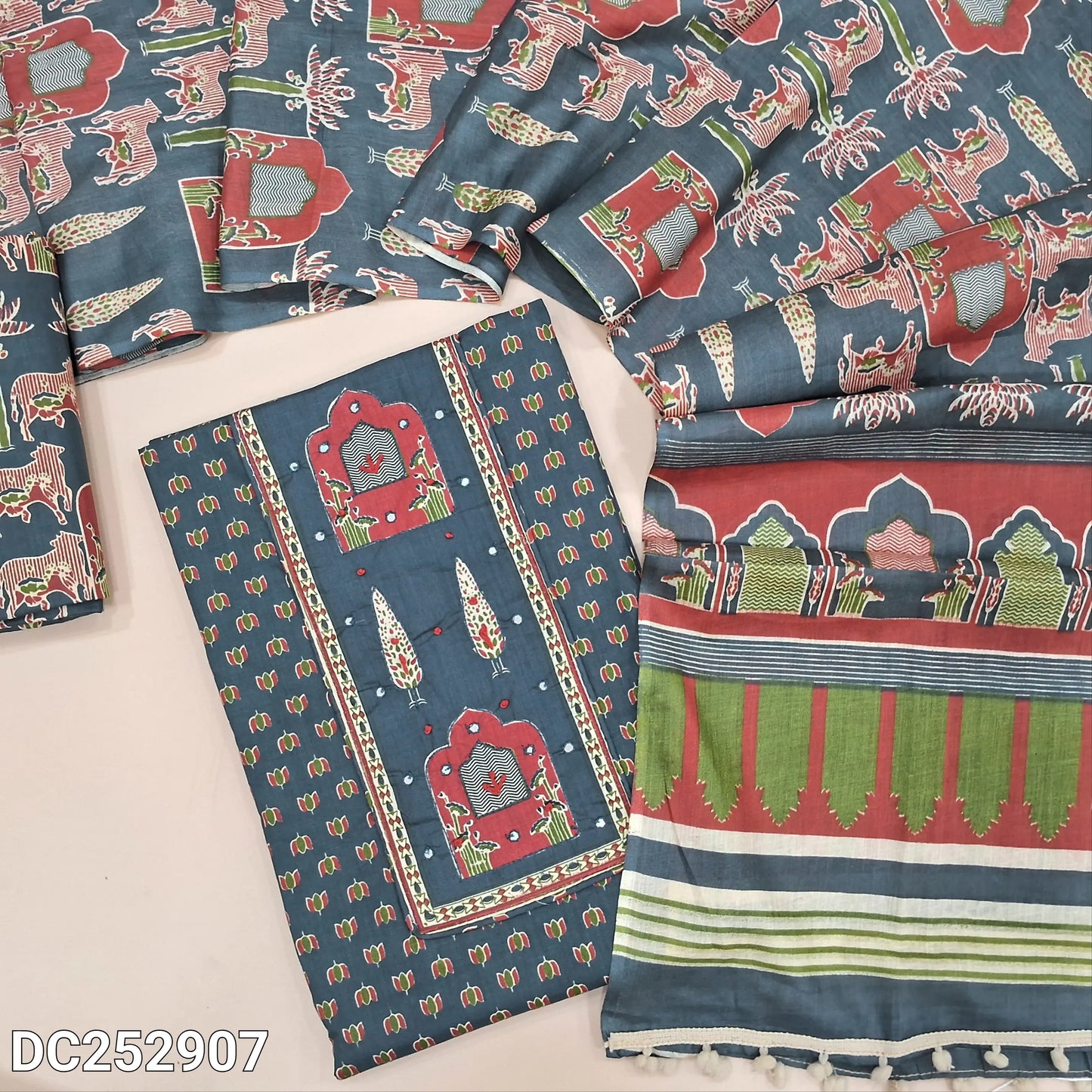 Printed dark Grey pure cotton unstitched salwar material (lining optional) thread work on yoke, printed cotton bottom, printed mul cotton dupatta with pompom tapings. DC252907