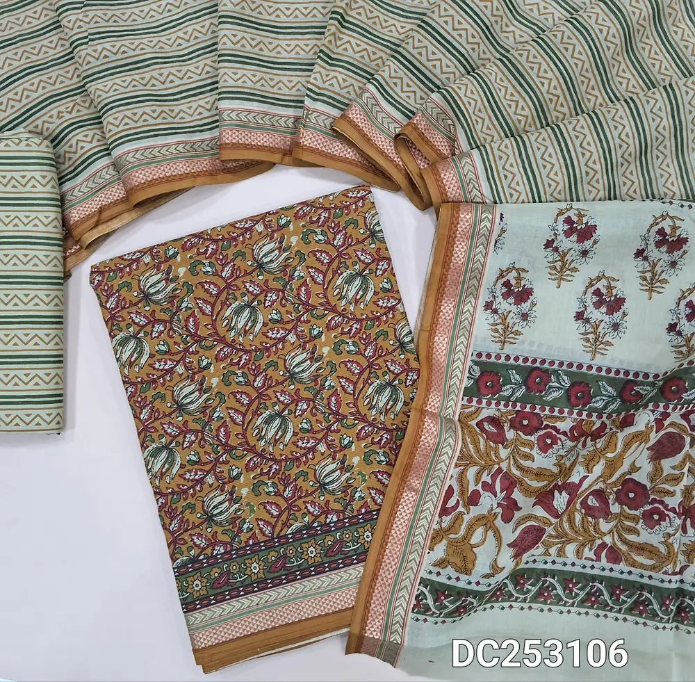 Floral printed mehandhi Yellow soft pure cotton unstitched salwar material (lining needed) zari woven borders, printed cotton bottom, printed mul cotton dupatta with zari woven borders. DC253106