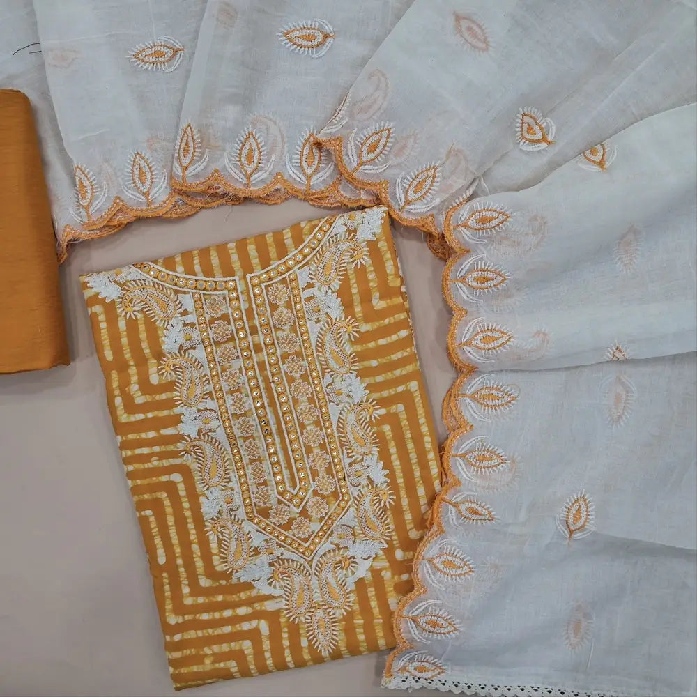 Mehandi Yellow modal wax batik dyed unstitched salwar material, foil work on yoke (Lining Needed) Matching silky bottom, embroidered soft cotton dupatta. JA261707