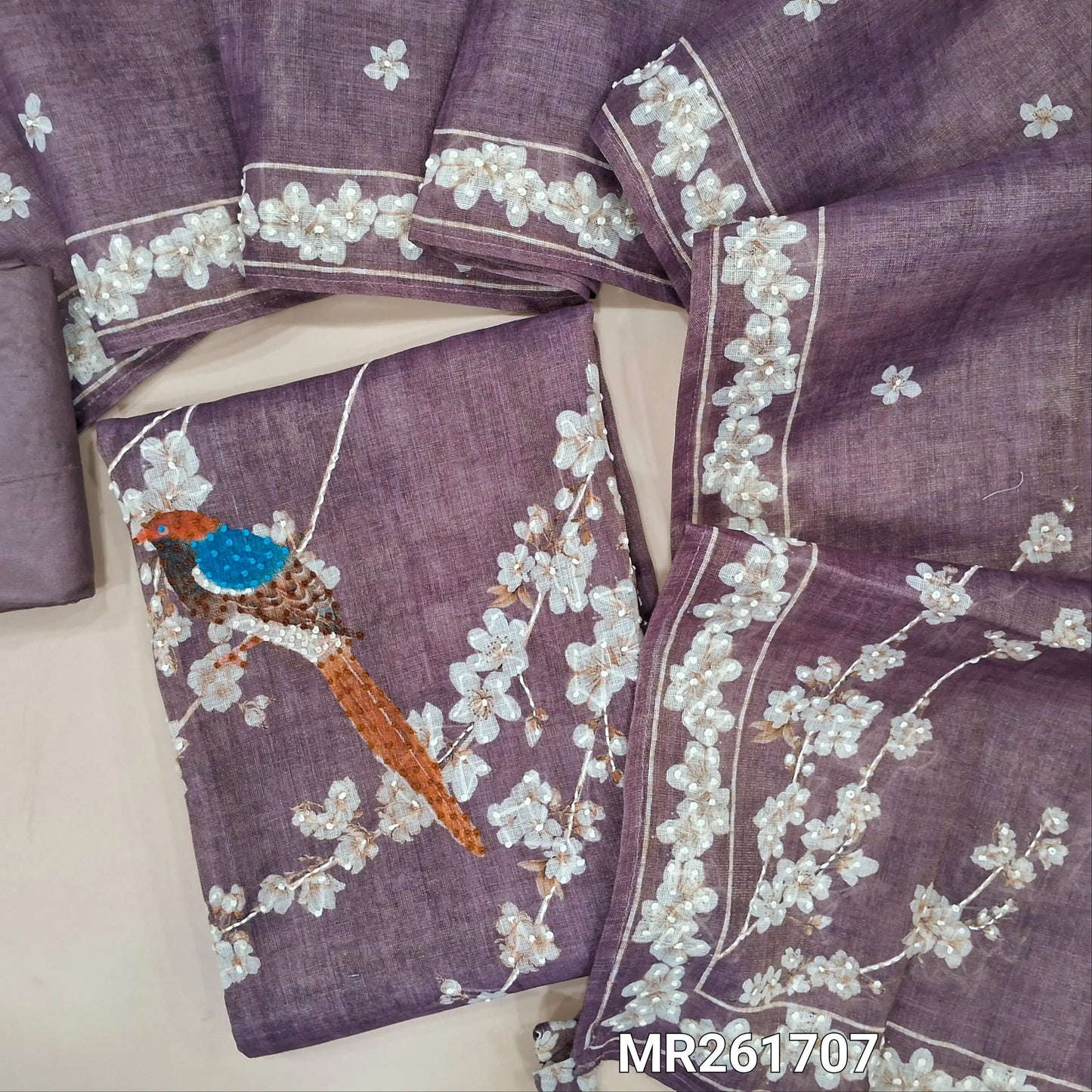 Dark mauve with golden tint tissue linen unstitched salwar material, embroidered  yoke,digital printed with hand embroidery work on front,(lining needed)santoon bottom, digital printed and hand embroidery work on tissue linen dupatta. MR261707