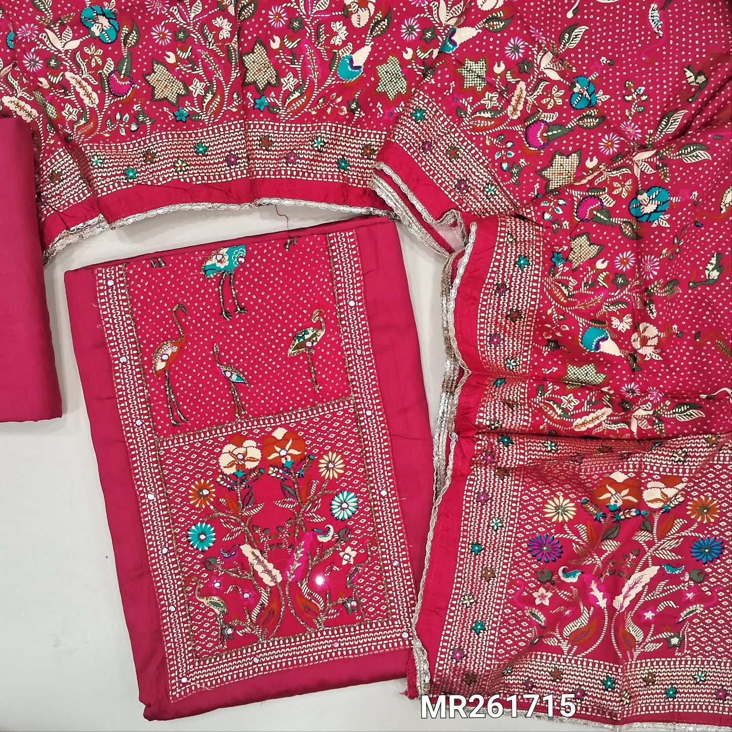 Bright pink glazed cotton unstitched salwar material,digital printed yoke with cut bead and embroidery work, faux mirror on front,(lining optional)matching spun cotton bottom,printed short width pure modal cotton dupatta. MR261715