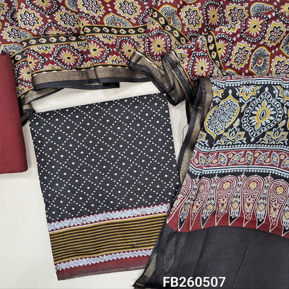 Dark brownish black soft silk cotton unstitched salwar material(lining needed)printed all over,contrast printed border, maroon cotton bottom,ajrak printed full length soft silk cotton with gold tissue borders TAPINGS NEEDED. FB260507