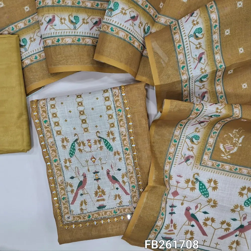 Mehandhi yellow with golden tint  tissue silk cotton unstitched salwar material(lining needed) printed yoke with real mirror work, matching silky bottom, printed tissue silk cotton dupatta. FB261708
