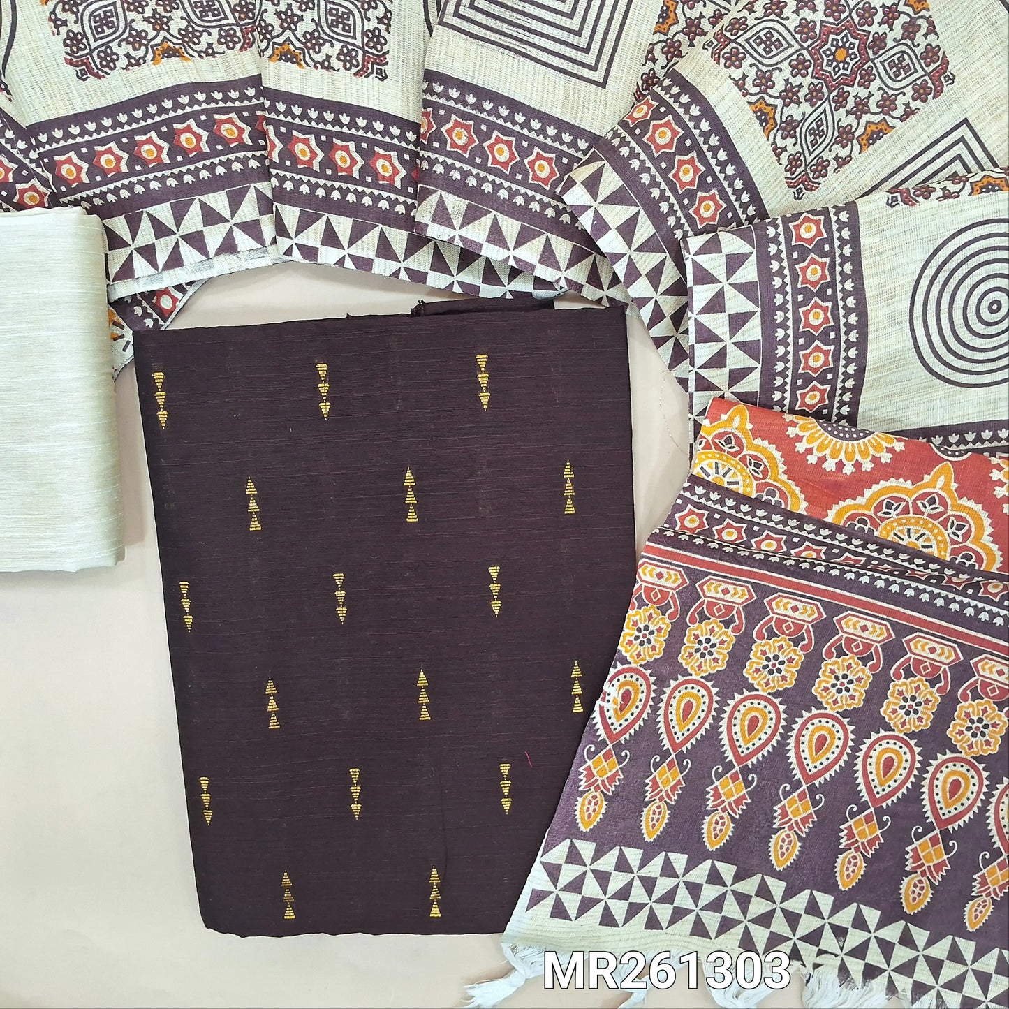 Dark brown slub silk cotton unstitched salwar material, gold zari buttas all over (lining needed)half white silk cotton bottom,block printed jute cotton dupatta with printed pallu. MR261303