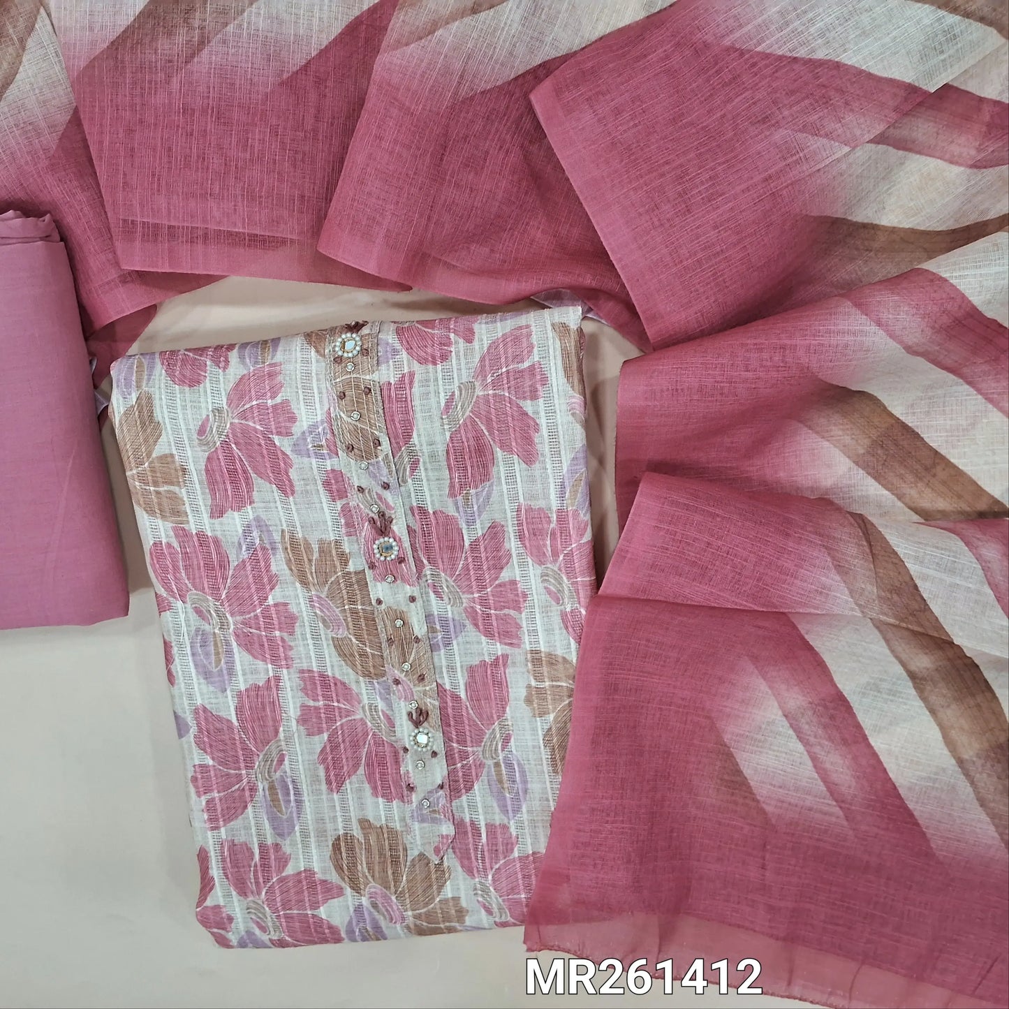 Half white jakard linen unstitched salwar material,zarodzi, french knot and mirror work on yoke, pastel shaded floral design all over,(lining needed)pink cotton bottom, Lehariya printed semi linen dupatta. MR261412