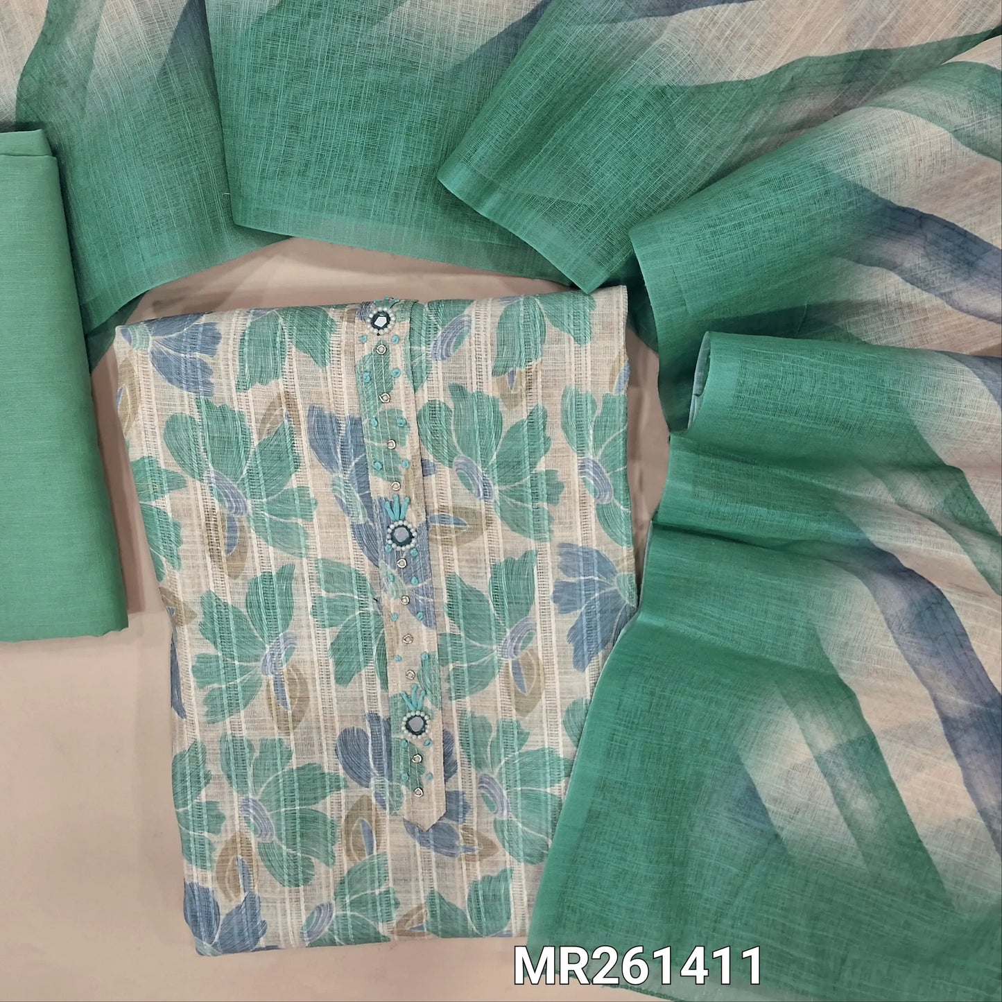 Half white jakard linen unstitched salwar material,zarodzi, french knot and mirror work on yoke, pastel shaded floral design all over,(lining needed)pastel blue cotton bottom, Lehariya printed semi linen dupatta. MR261411
