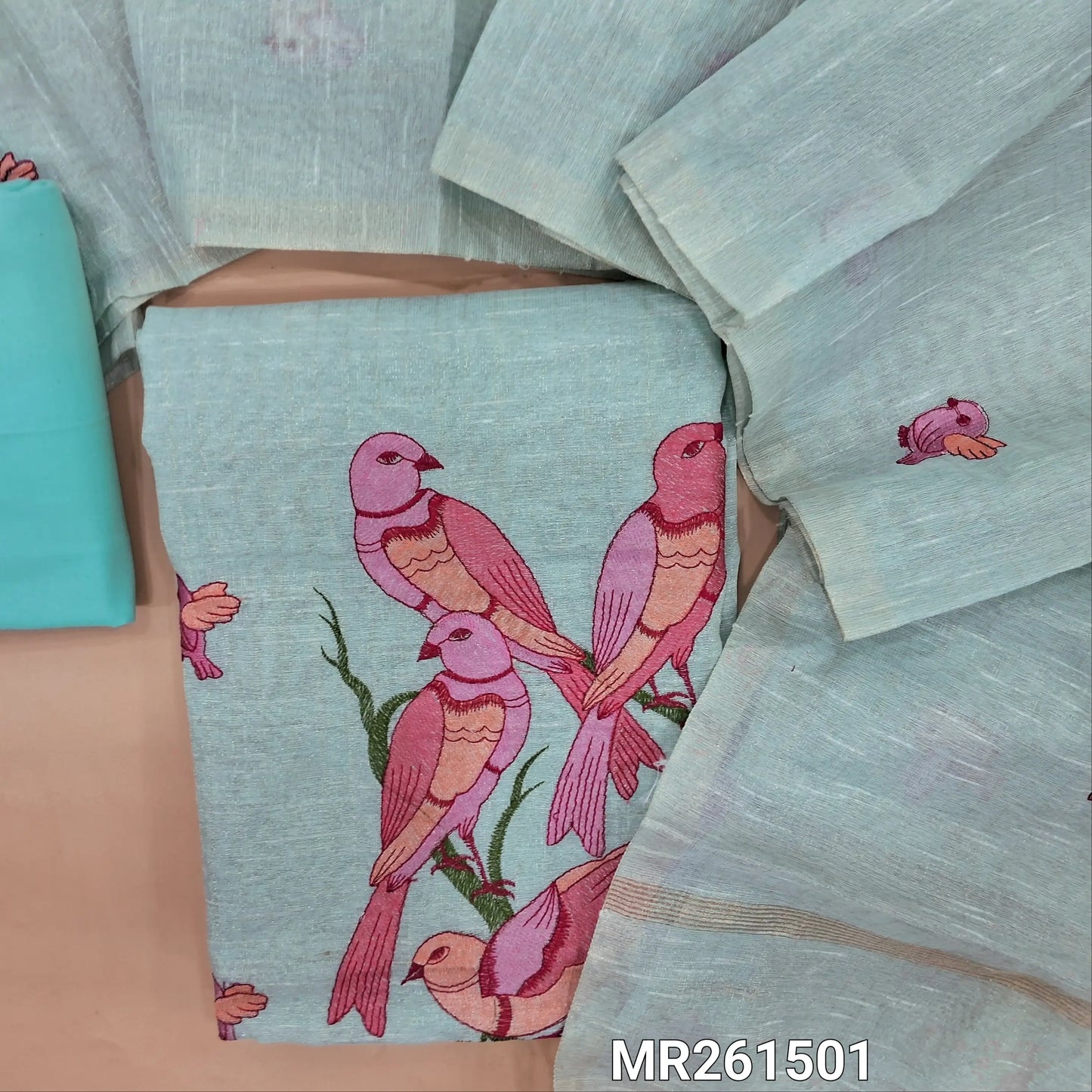 Pastel blue with golden tint tissue linen unstitched salwar material, zari lines all over,rich thread embroidery on front, (lining needed)cotton bottom,embroidery on full length tissue linen dupatta. MR261501