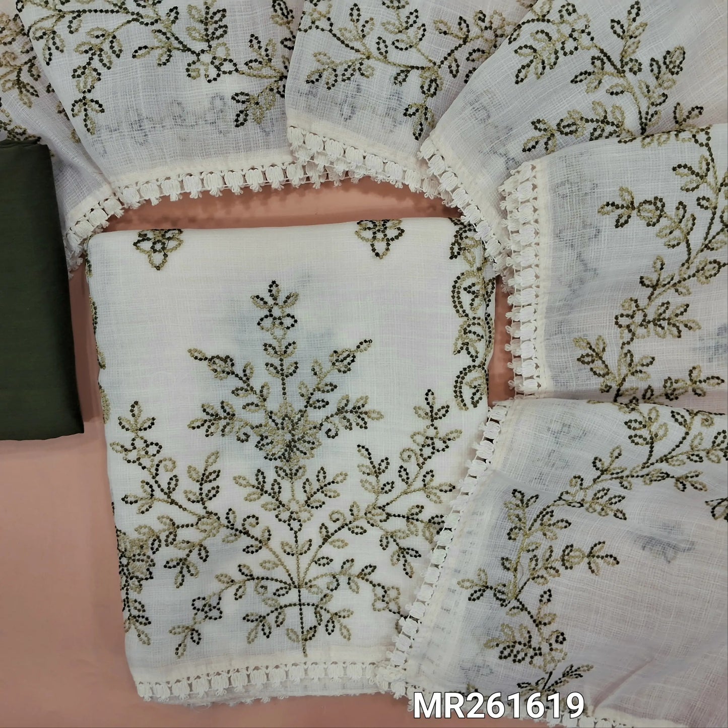 Off white base fancy kota silk cotton unstitched salwar material, embroidery work on front(thin, lining needed)Dark green silk cotton or silky bottom, embroidery work on full length kota silk cotton dupatta with lace tapping. MR261619