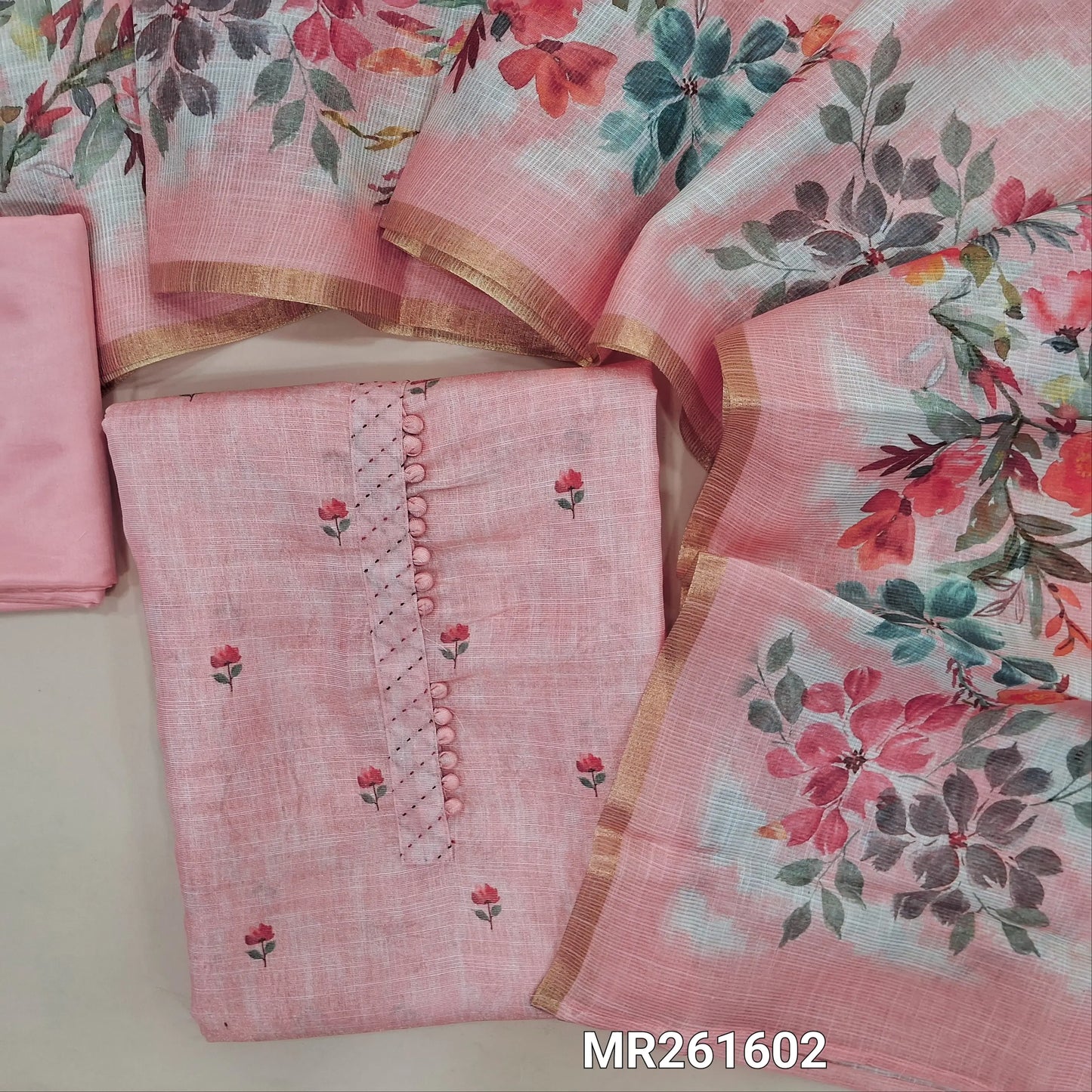 Pastel pink tissue silk cotton unstitched salwar material,potli buttons on yoke, floral printed all over, (lining needed)matching silky bottom,digital printed tissue silk cotton dupatta with tissue borders. MR261602
