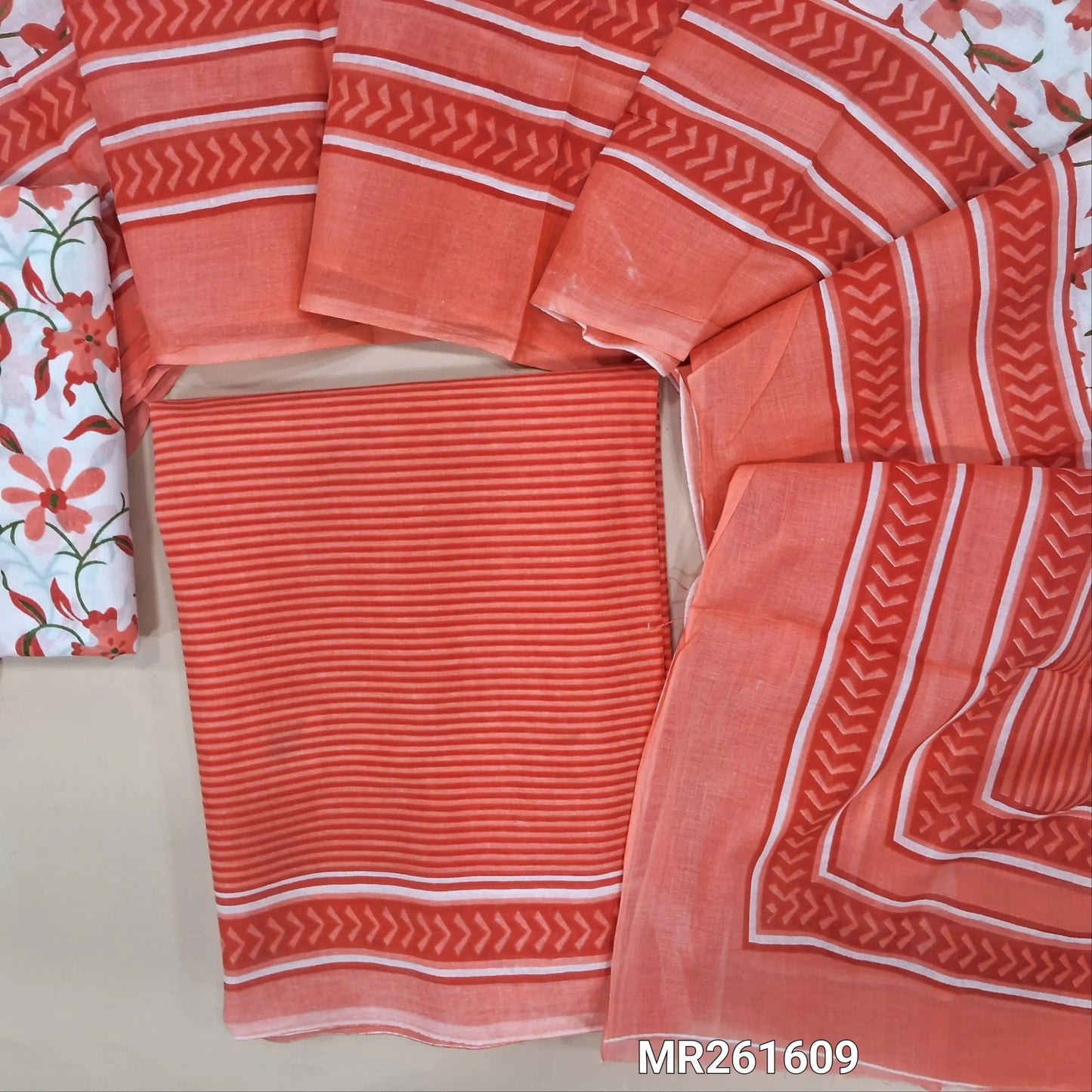 Peach cambric cotton unstitched salwar material,vertical stripes all over,(lining optional)floral printed cambric cotton bottom, floral printed full length cambric cotton dupatta with pallu and printed borders. MR261609