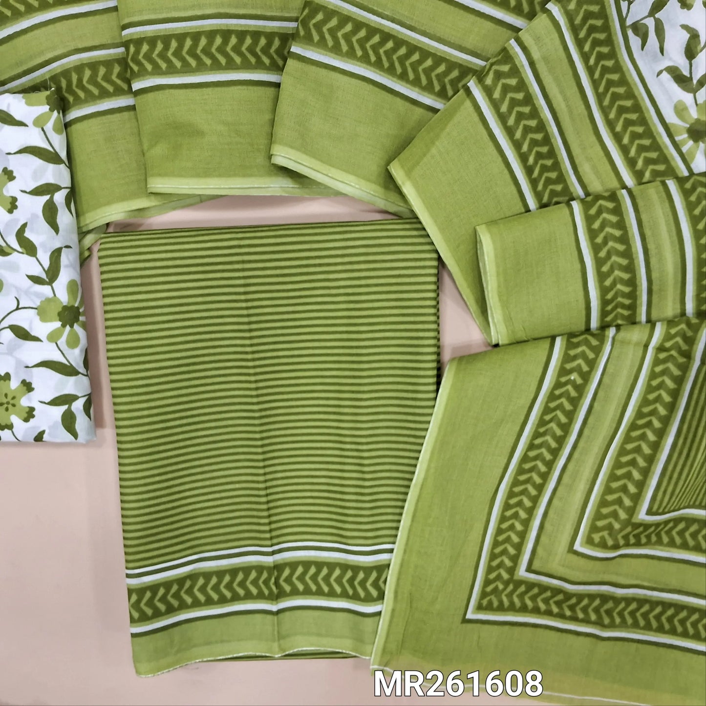 Green cambric cotton unstitched salwar material,vertical stripes all over,(lining optional)floral printed cambric cotton bottom, floral printed full length cambric cotton dupatta with pallu and printed borders. MR261608