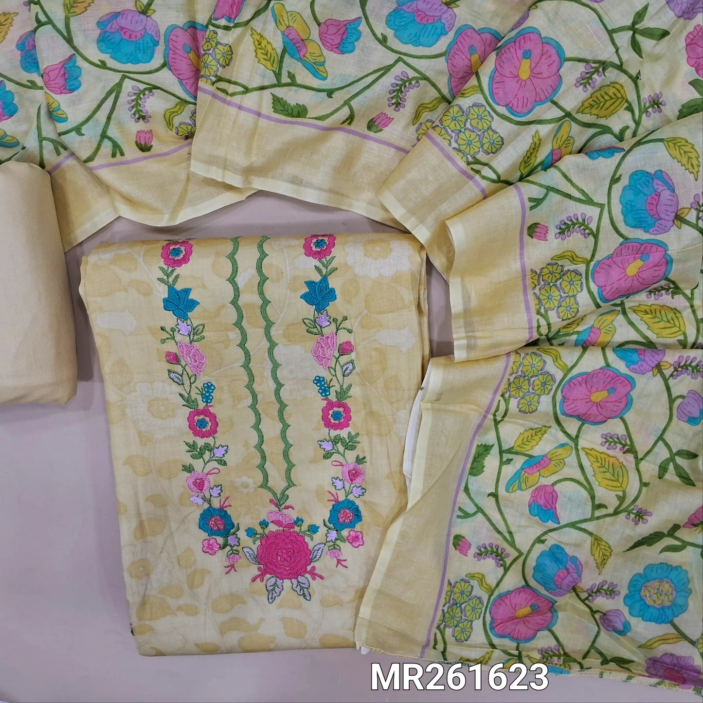 Pastel yellow satin cotton unstitched salwar material (lining optional) embroidery work on yoke, printed all over, embroidery work on daman,matching spun cotton bottom,colourful floral printed full length pure cotton dupatta. MR261623