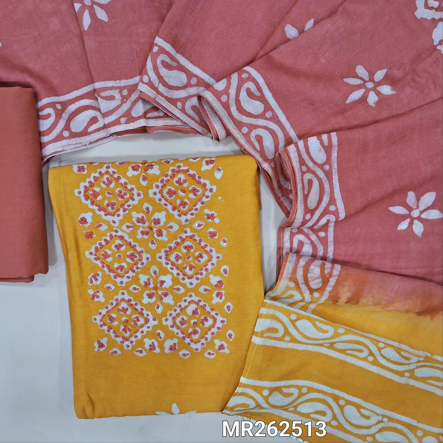 Mehandhi yellow chanderi silk cotton unstitched salwar material,wax batik yoke with embroidery work, wax batik design all over(lining needed)peachish pink silk cotton bottom,wax batik design on dual shaded chanderi silk cotton dupatta. MR262513