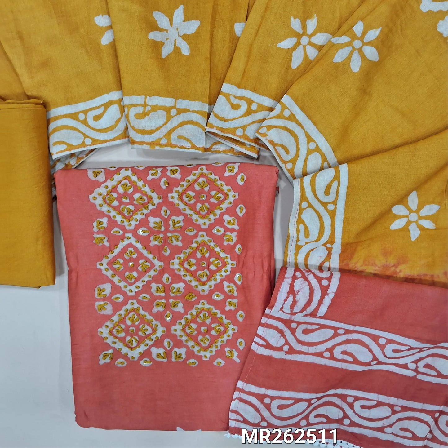 Peachish pink chanderi silk cotton unstitched salwar material,wax batik yoke with embroidery work, wax batik design all over(lining needed)mehandhi yellow silk cotton bottom,wax batik design on dual shaded chanderi silk cotton dupatta. MR262511
