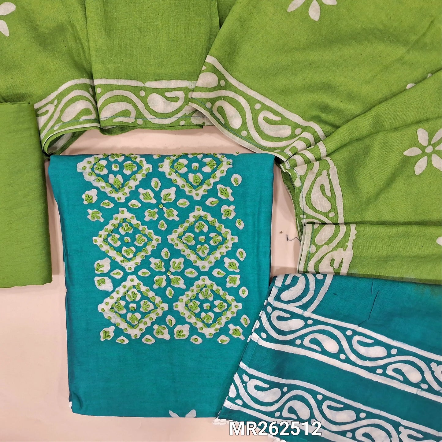 Teal blue chanderi silk cotton unstitched salwar material,wax batik yoke with embroidery work, wax batik design all over(lining needed)light green silk cotton bottom,wax batik design on dual shaded chanderi silk cotton dupatta. MR262512