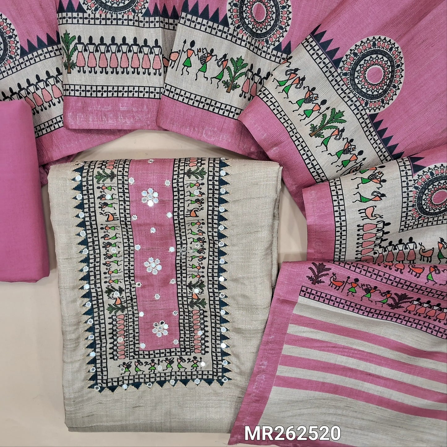 Light greyish beige semi gicha unstitched salwar material, warli printed with faux mirror work on yoke(thin fabric, lining needed)Pink cotton bottom, digital warli printed silk cotton dupatta. MR262520