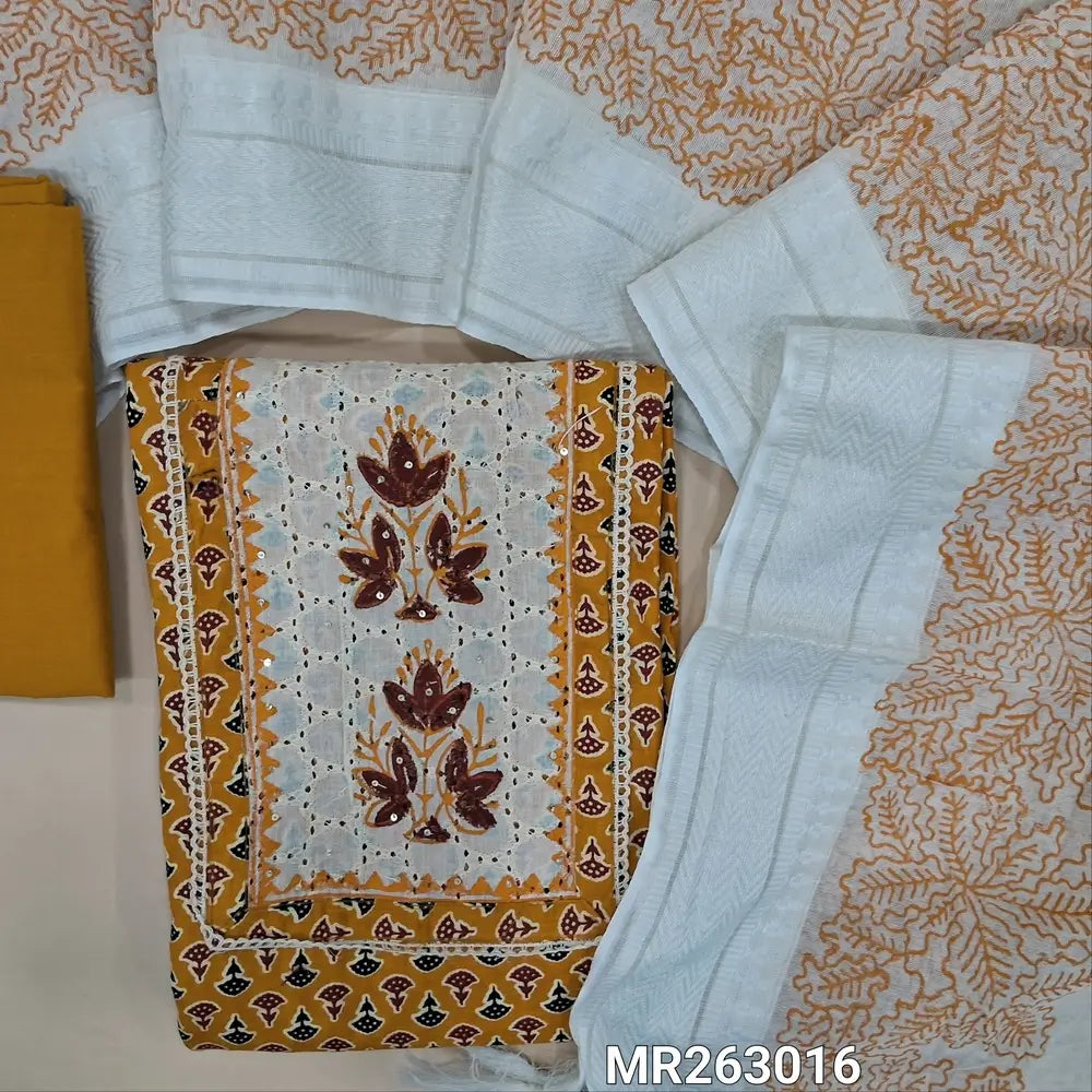 Dark fenugreek yellow printed pure cotton unstitched salwar material, block printed yoke with schiffli work(lining optional)matching cotton bottom, hand block printed and applique work on fancy silk cotton dupatta(TAPING NEEDED). MR263016