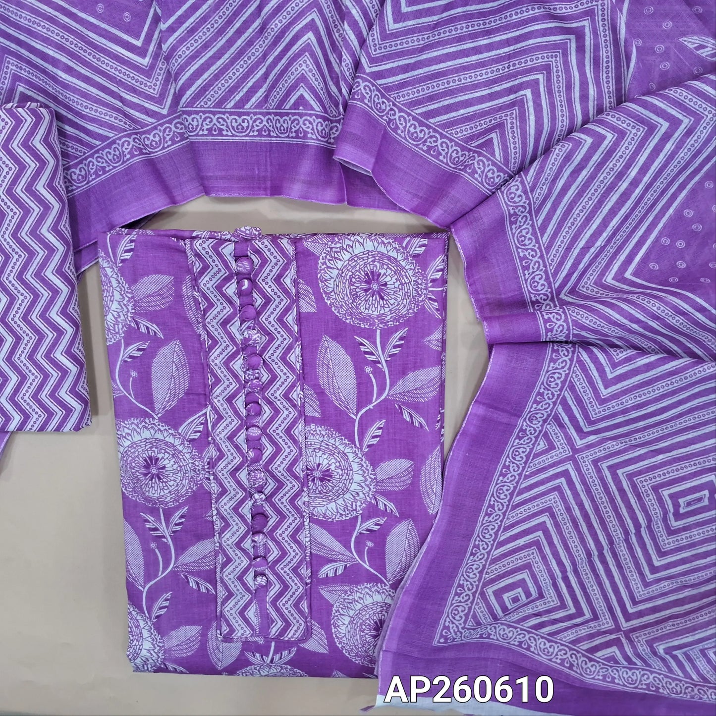 Lavender shade printed soft cotton unstitched salwar material, potil buttons on yoke (thin,lining needed)zigzag printed cotton bottom, printed soft cotton dupatta. AP260610