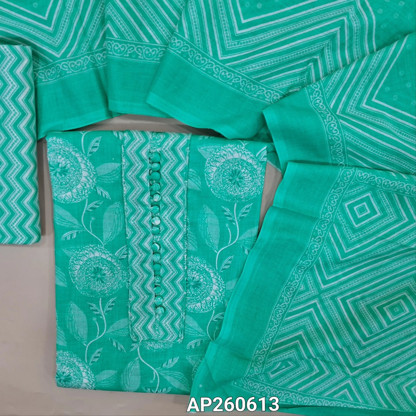 Pastel blue printed soft cotton unstitched salwar material, potil buttons on yoke (thin,lining needed)zigzag printed cotton bottom, printed soft cotton dupatta. AP260613
