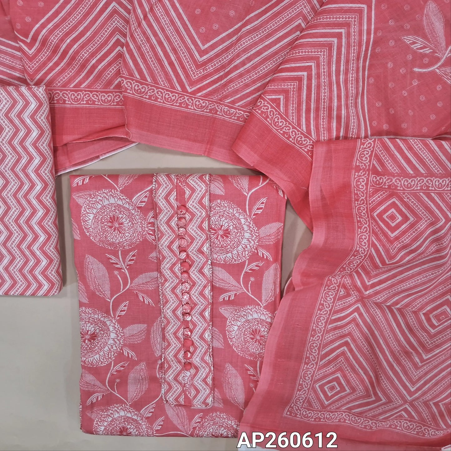 Pastel pink printed soft cotton unstitched salwar material, potil buttons on yoke (thin,lining needed)zigzag printed cotton bottom, printed soft cotton dupatta. AP260612