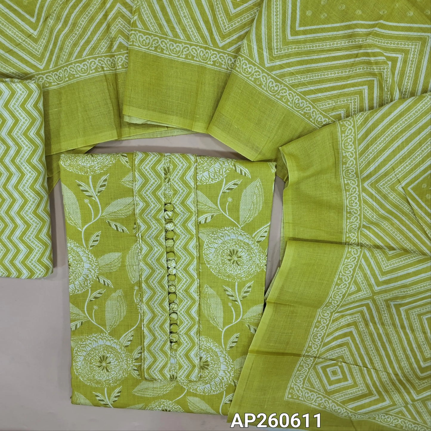 Light green printed soft cotton unstitched salwar material, potil buttons on yoke (thin,lining needed)zigzag printed cotton bottom, printed soft cotton dupatta. AP260611