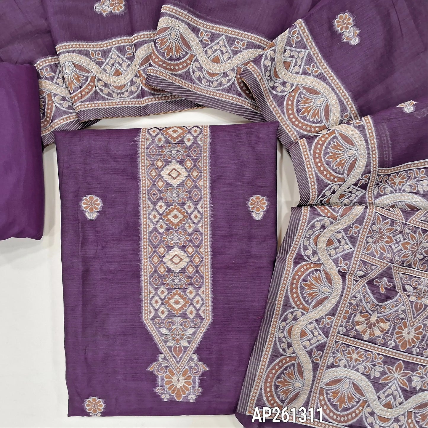 Dark purple silk cotton unstitched salwar material, floral buttas on front,thread weaving design on yoke and daman, (Silky, Lining Needed) silky bottom,buttas on silk cotton dupatta with rich thread weaving on pallu and borders. AP261311