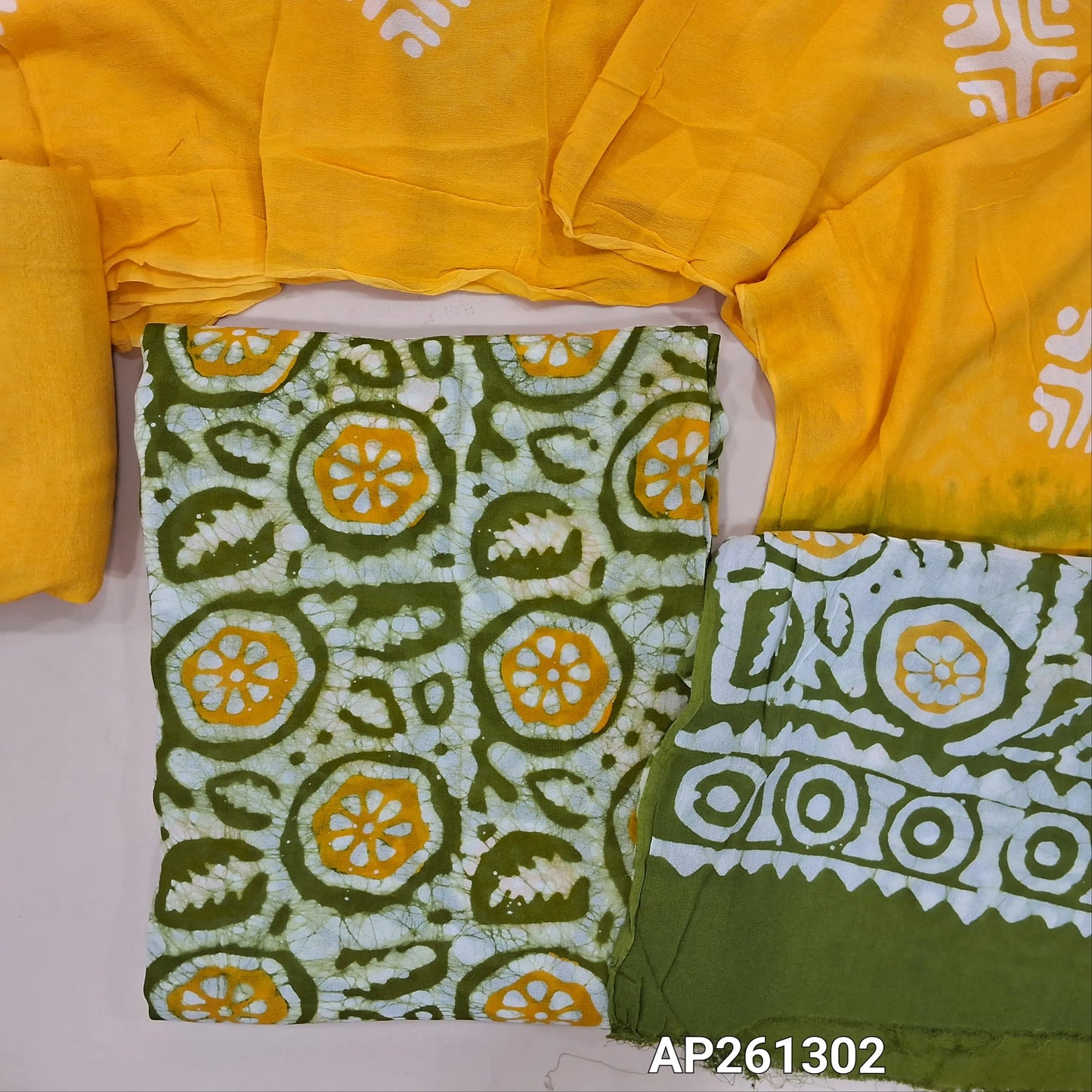 Green and yellow original batik dyed pure crepe georgette unstitched salwar material (Lining Needed), matching santoon bottom, pure crepe georgette dual shaded dupatta (TAPINGS NEEDED). AP261302