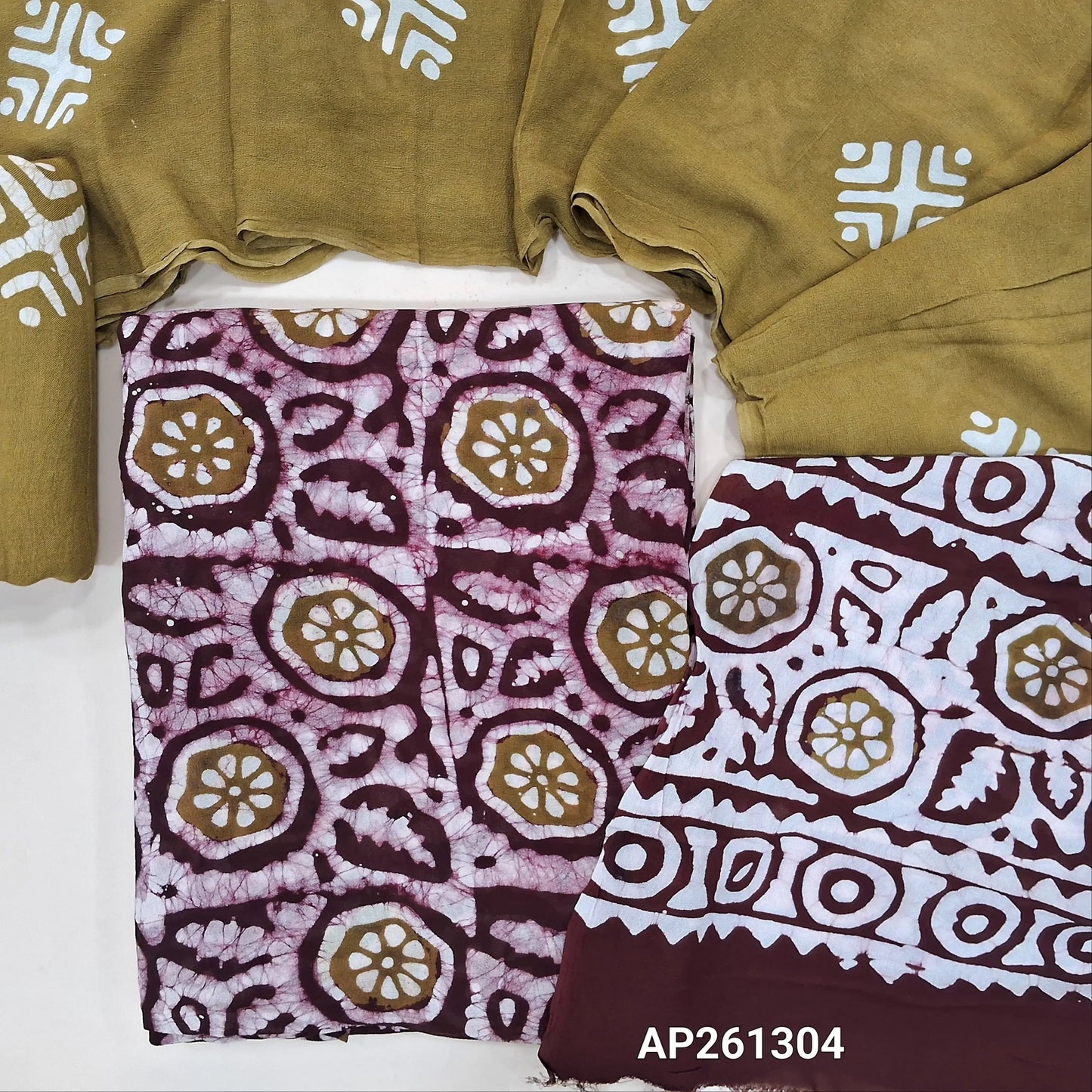 Dark maroon and mehandi green original batik dyed pure crepe georgette unstitched salwar material (Lining Needed), matching santoon bottom, pure crepe georgette dual shaded dupatta (TAPINGS NEEDED). AP261304
