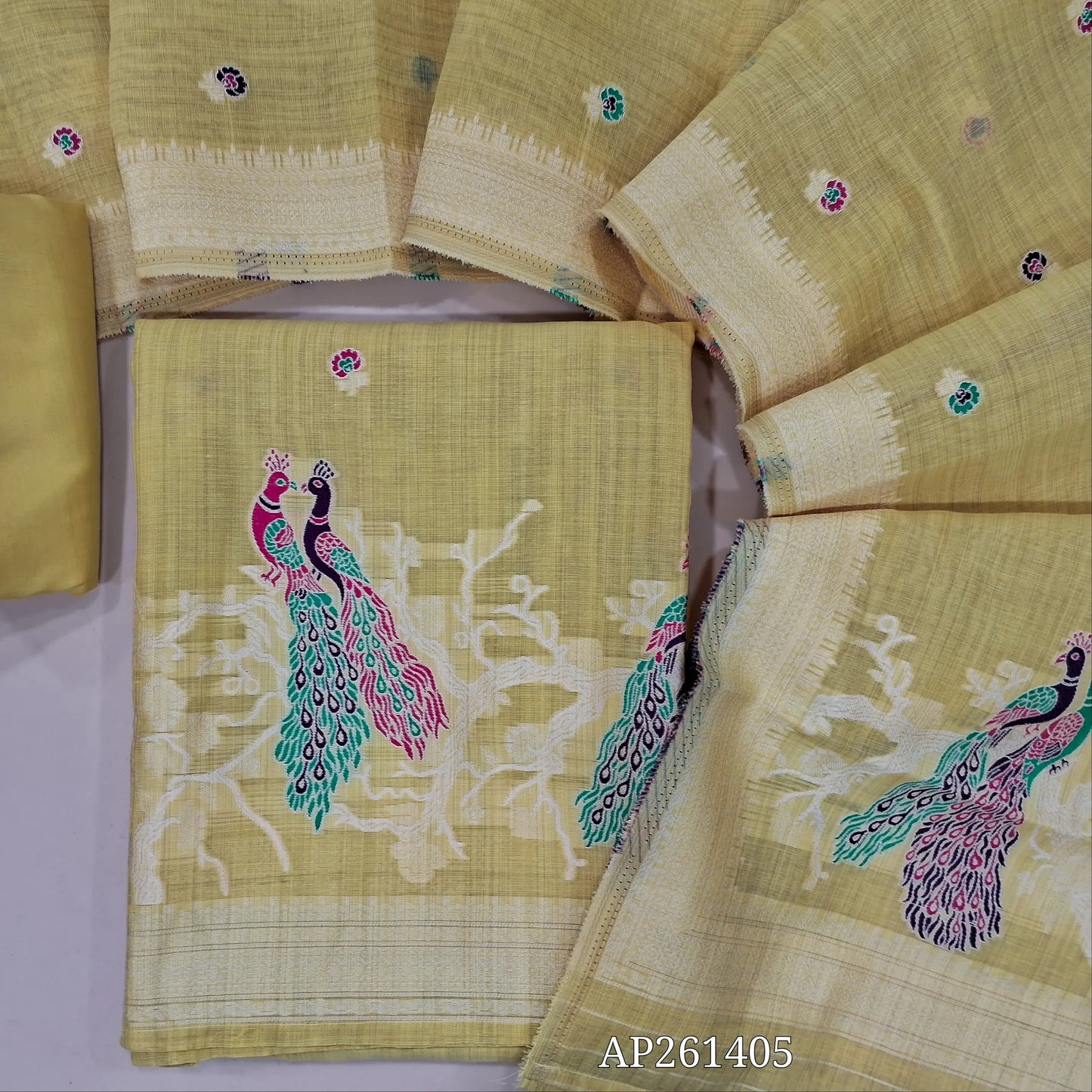 Pastel yellow silk cotton unstitched salwar material, floral buttas on front,thread weaving design on daman, (Silky, Lining Needed)silky bottom, thread weaving on soft silk cotton dupatta with thread woven borders. AP261405