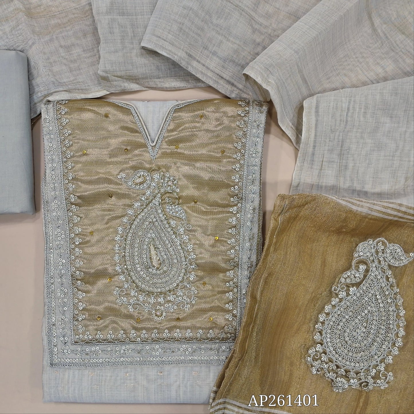 Half white base silk cotton unstitched salwar material,zari buttas all over,gold tissue yoke with zarodzi, sequins and cutbead(lining needed)drum dyed cotton fabric for lining, NO BOTTOM, silk cotton dupatta with gold tissue with zari work pallu. AP261401