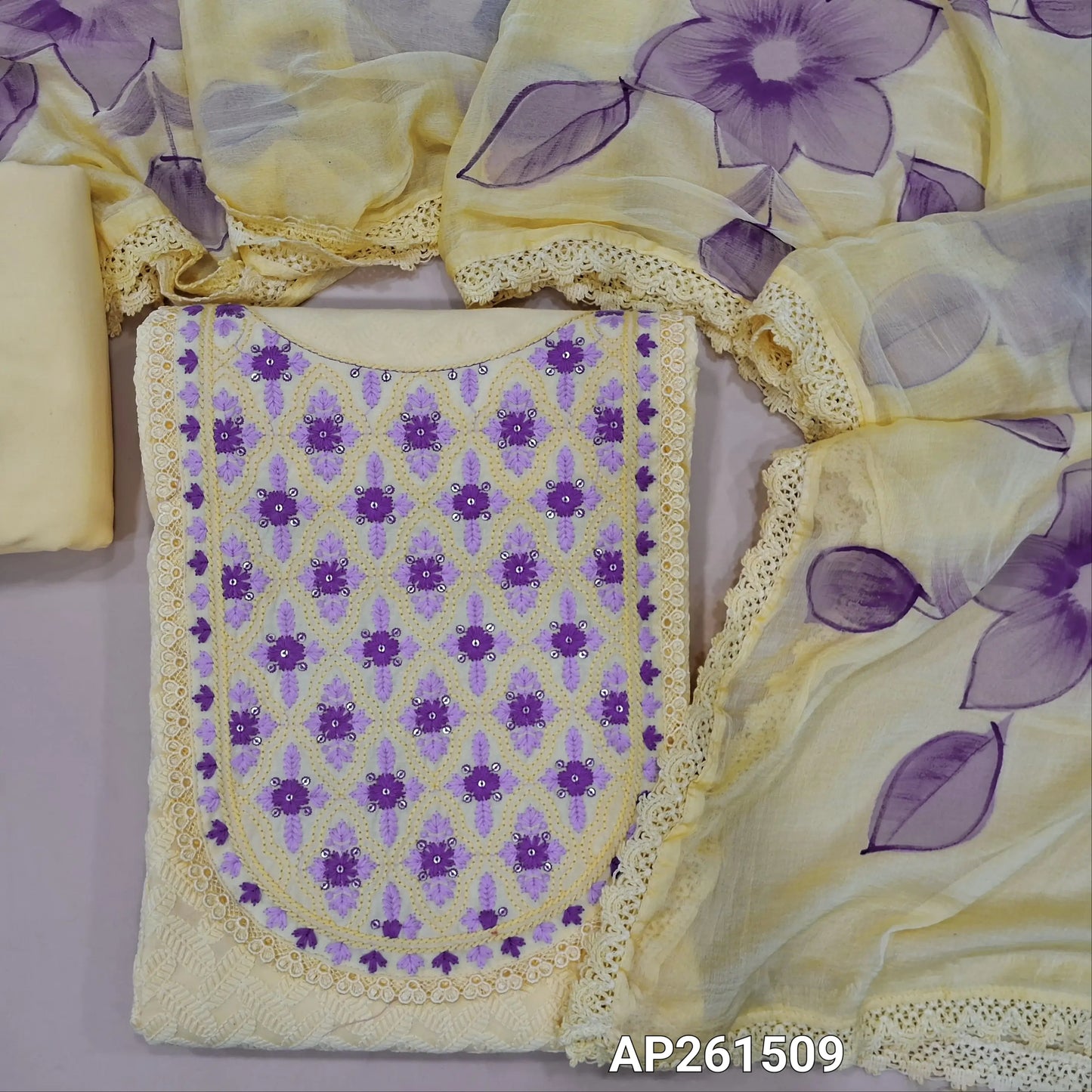 Pastel yellow pure cotton unstitched salwar material, embroidered yoke with lace work, thread embriodery on front,(lining needed)matching cotton bottom,brush paint work on fancy chiffon dupatta with lace tapping. AP261509