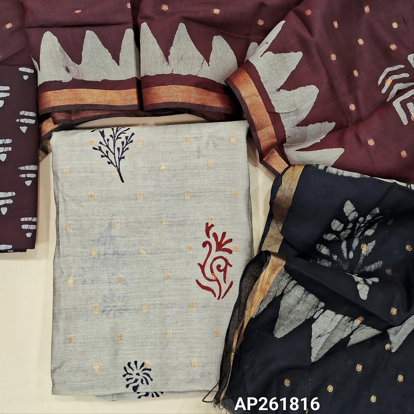Light greyish beige block Printed soft silk cotton unstitched salwar material (lining needed) zari buttas all over, dark maroon printed batik cotton bottom,zari buttas dual shaded silk cotton dupatta with gold tissue borders.(TAPING NEEDED) AP261816