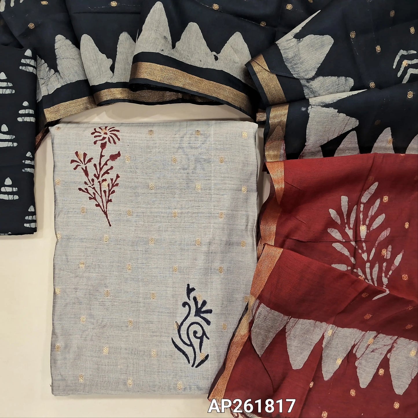 Light greyish beige block Printed soft silk cotton unstitched salwar material (lining needed) zari buttas all over, black printed batik cotton bottom,zari buttas dual shaded silk cotton dupatta with gold tissue borders.(TAPING NEEDED) AP261817