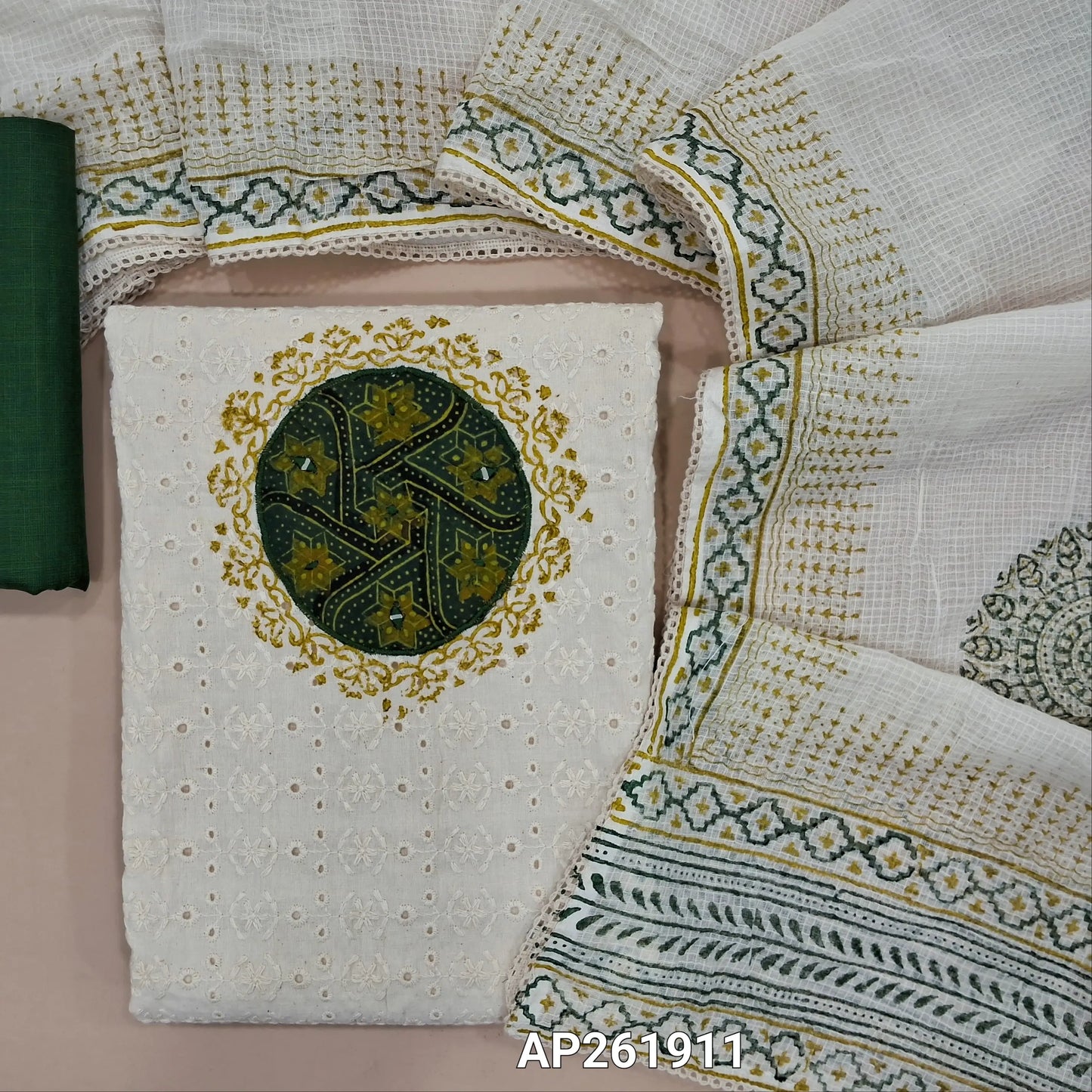 Off white base schiffli embroidered cotton unstitched salwar material (lining needed) ajrak patch yoke with block printed and real mirror,dark green cotton bottom, hand block printed,and patch work on kota cotton dupatta with lace taping. AP261911