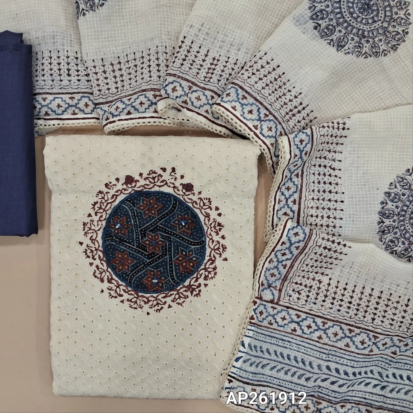 Off white base schiffli embroidered cotton unstitched salwar material (lining needed) ajrak patch yoke with block printed and real mirror,dark blue cotton bottom, hand block printed,and patch work on kota cotton dupatta with lace taping. AP261912