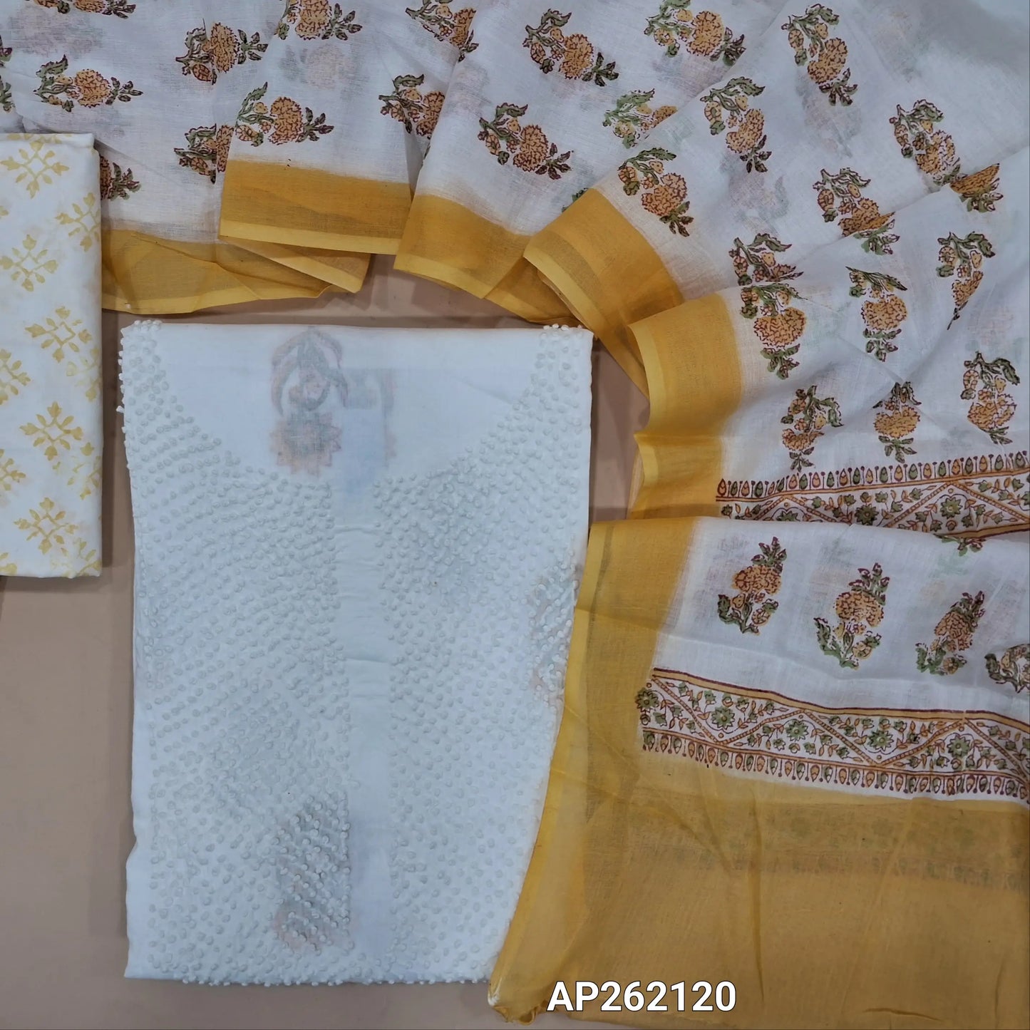 White base pure mul cotton unstitched salwar material, hand embroiderd french knot work on yoke(lining needed) hand block printed allover, yellow block printed cotton bottom, hand block printed with pure mul cotton dupatta. (TAPING NEEDED) AP262120