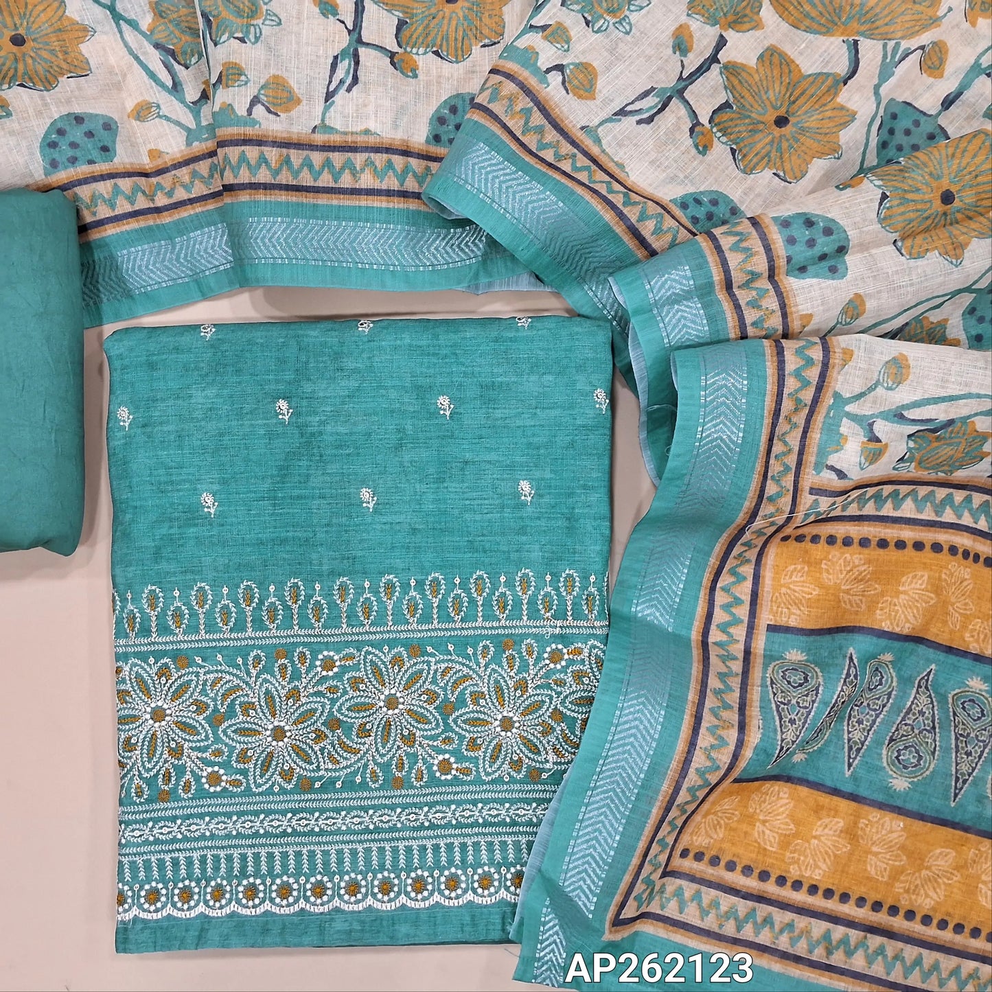 Light turquoise blue abstract printed premium linen unstitched salwar material,floral embroidery work on front( lining needed) rich embroidery work on daman, matching silky bottom, floral printed semi linen dupatta with silver zari borders. AP262123