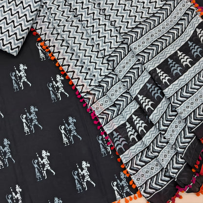 Black pure soft cotton unstitched salwar material, pompom taping on daman,warli printed all over( soft,lining optional)zigzag printed cotton bottom,hand block printed full length mul cotton dupatta with pompom tapping. AP262215