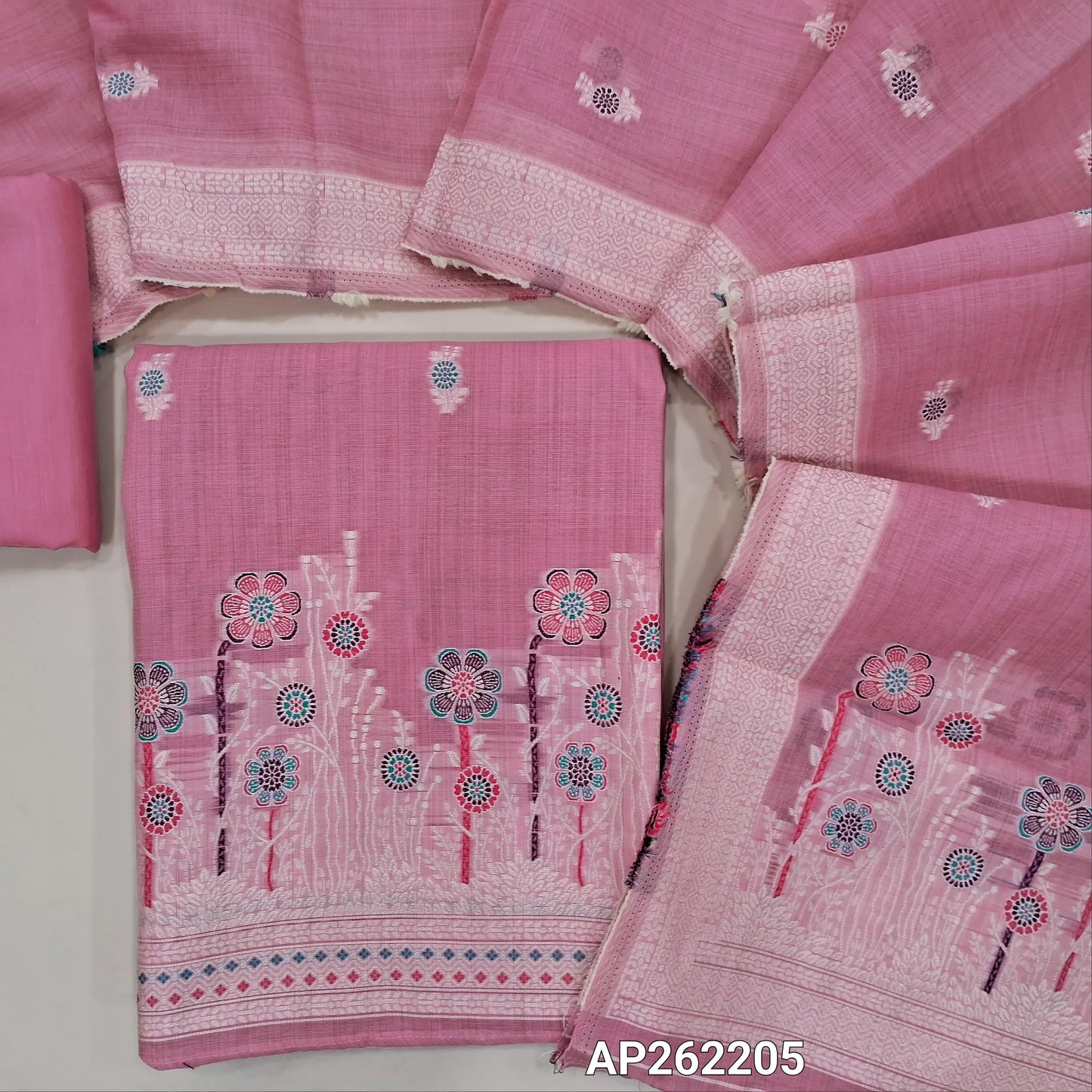 Lotus pink silk cotton unstitched salwar material,thread buttas on front,thread weaving on yoke and daman,(Silky, Lining Needed)matching silky bottom, floral buttas on silk cotton dupatta with thread weaving pallu and borders(TAPPING NEEDED). AP262205