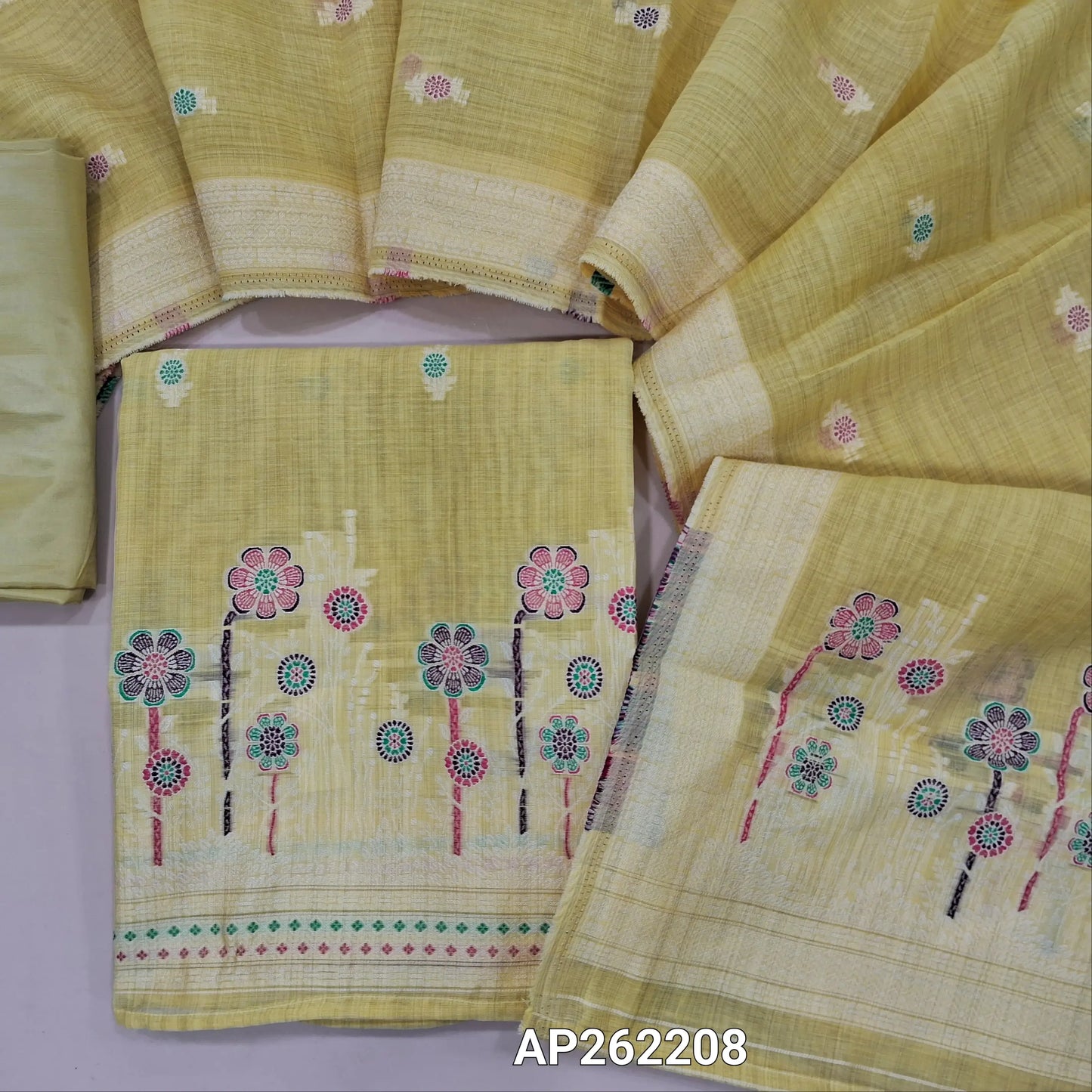 Pastel yellow silk cotton unstitched salwar material,thread buttas on front,thread weaving on yoke and daman,(Silky, Lining Needed)matching silky bottom, floral buttas on silk cotton dupatta with thread weaving pallu and borders(TAPPING NEEDED). AP262208